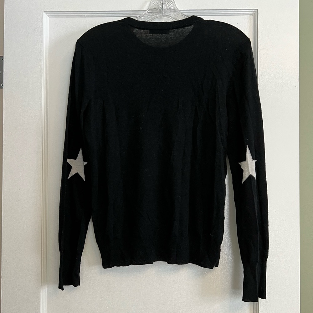 Equipment black crew neck sweater with white stars on sleeves
